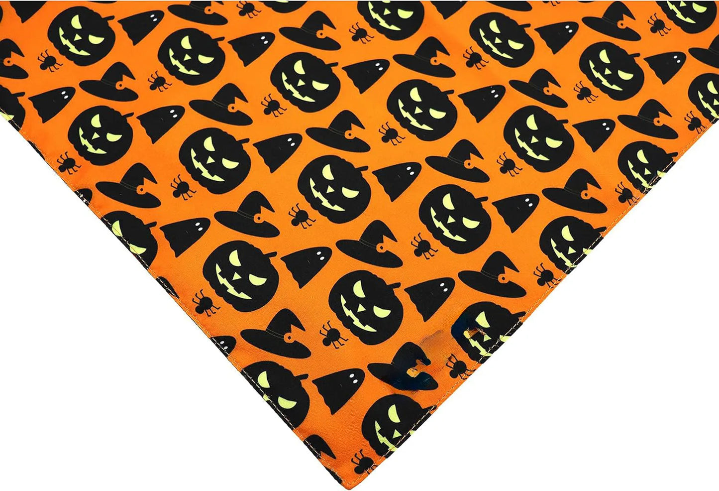 Black and orange reversible Halloween dog bandana with pumpkin and spider web print laid flat