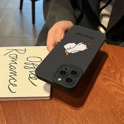 Black silicone iPhone case with a raised carved cartoon duck design on the back.
