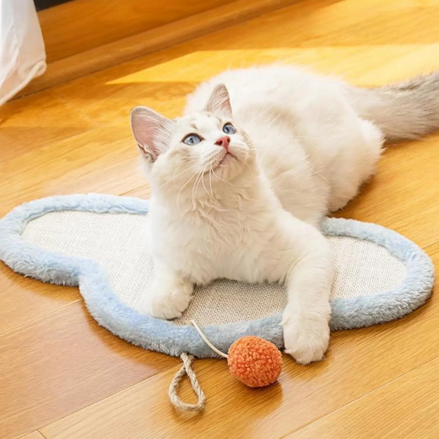 White wall-mounted cat scratching mat with sleeping cat cartoon design, made from natural sisal.