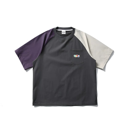 Dark grey loose fit men's t-shirt with contrast colour raglan sleeves on a hanger.