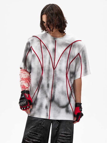 Padded shoulder short sleeve t-shirt with raised 3D line patchwork detailing on the front.