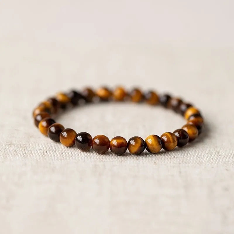 Single-circle beaded Buddha bracelet with tigereye Dzi stone, showing bead size options.