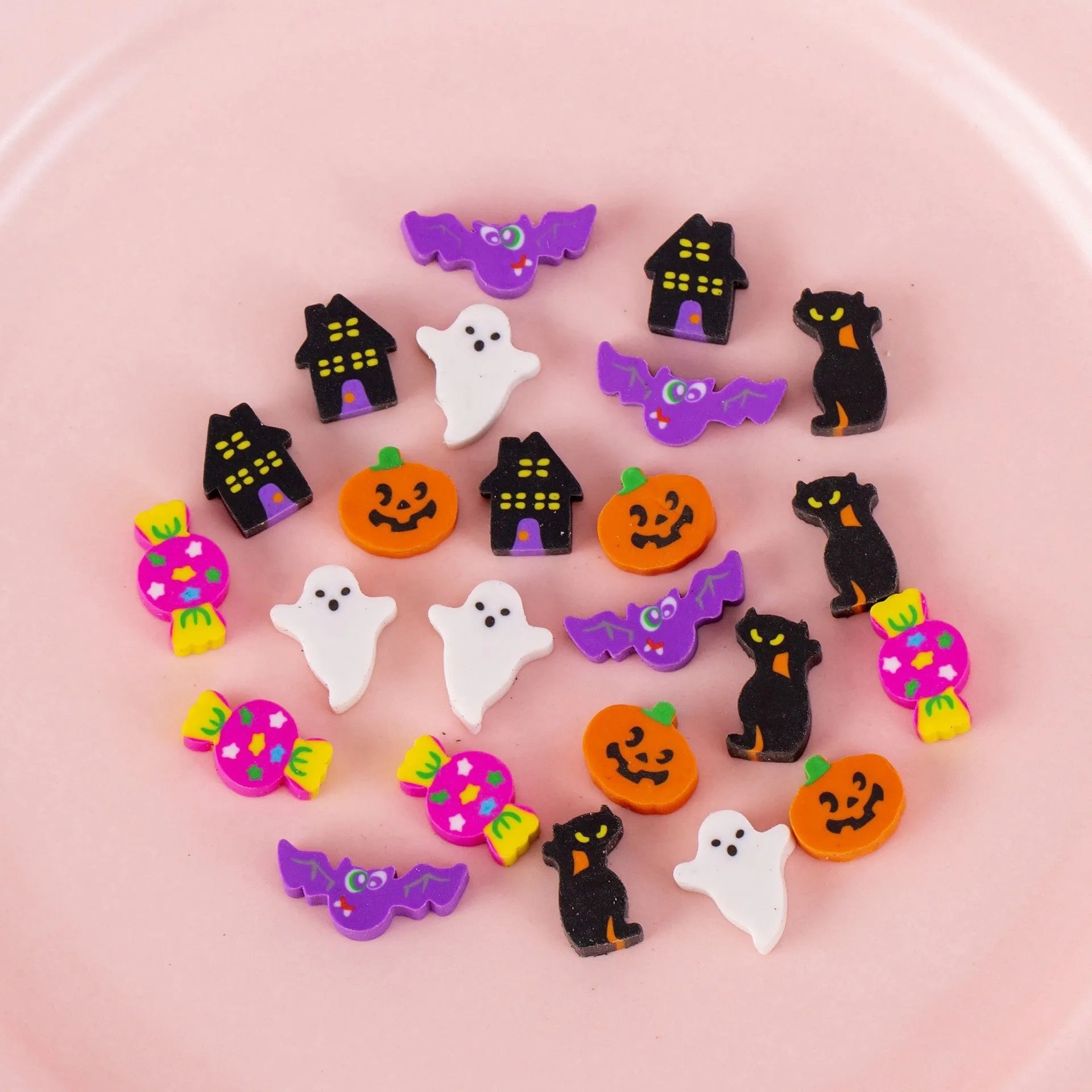 Assortment of 50 small cartoon erasers in pearlescent bags, showing fruit, animal, and holiday designs.