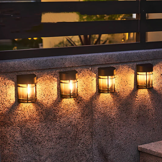 Solar outdoor wall light with warm glow, monocrystalline panel, and IP65 waterproof rating for garden use