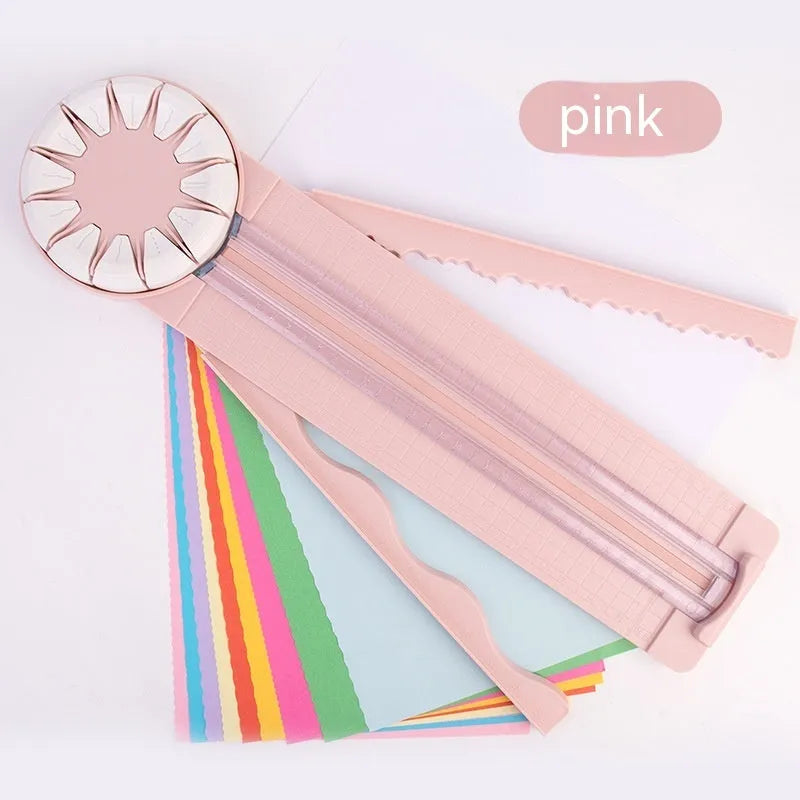 Pink 12-in-1 paper cutter with dotted guides measuring 46.2cm length on craft table