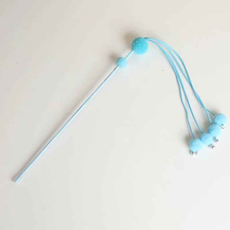 Funny cat stick toy with colourful feather tassel on elastic cord, shown in blue, pink, and purple options.