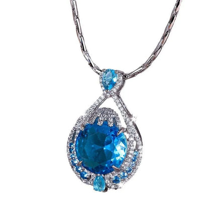 Women's blue crystal necklace with geometric fireworks-cut pendant on water wave alloy chain