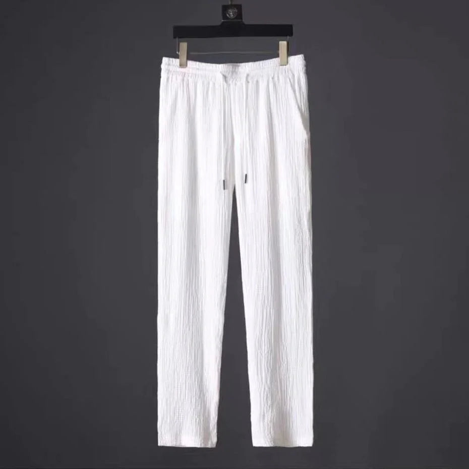 Men's summer leisure suit with loose-fit short sleeve top and drawstring trousers