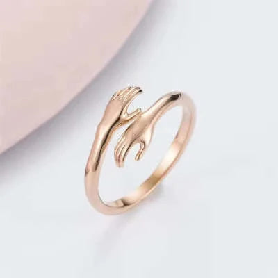 Adjustable Alloy Hands Hug Ring in gold and silver, featuring a unique geometry design