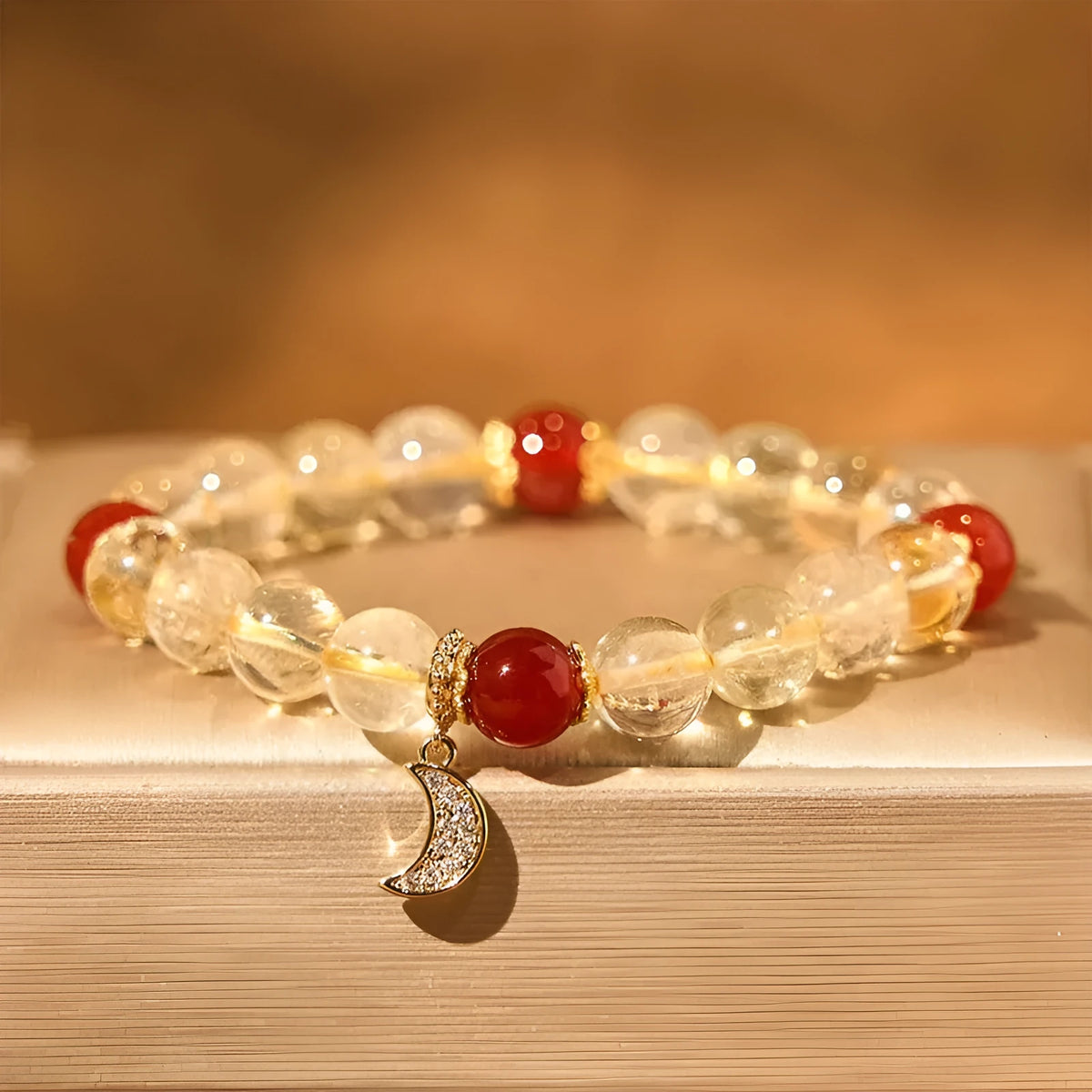 Citrine red agate moon boom crystal bracelet for women on a white background.