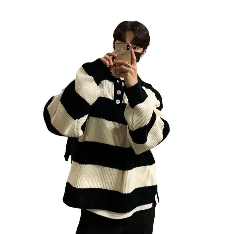 Man wearing a loose-fit black and grey striped polyester pullover sweater