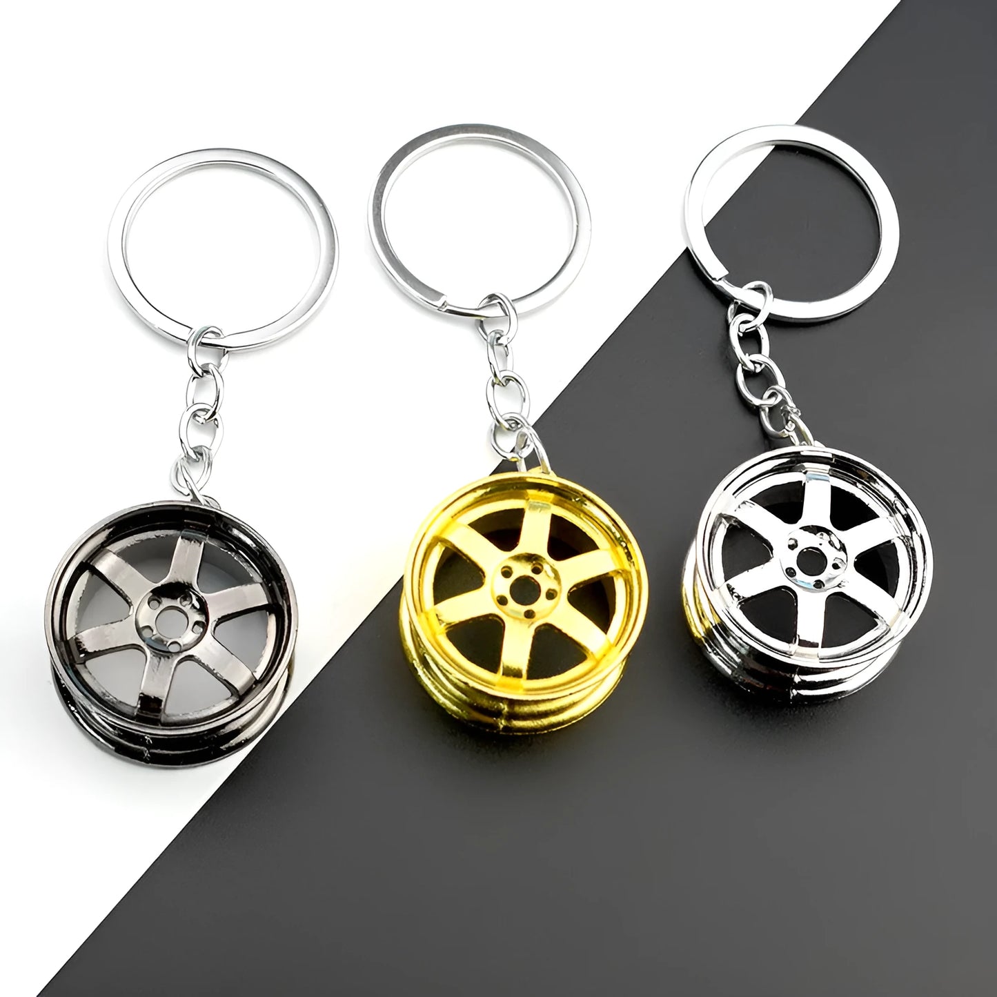 Zinc alloy car wheel hub keychain in black, gold and silver colour options