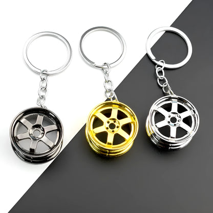 Zinc alloy car wheel hub keychain in black, gold and silver colour options