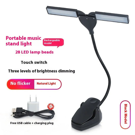 Black music stand light with flexible neck attached to metal music stand, illuminating sheet music