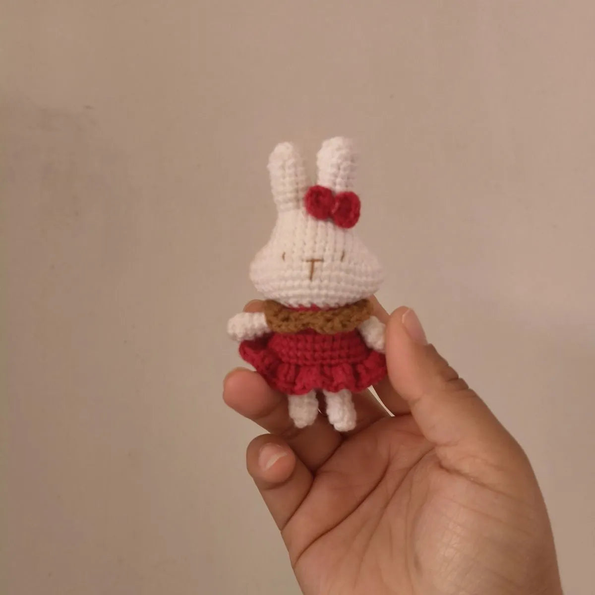 Hand-crocheted wool yarn rabbit keychain pendant with decorative design