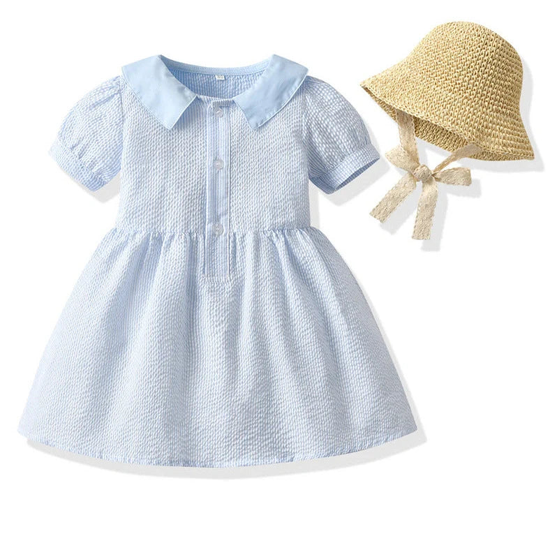 Girl wearing yellow plaid princess cotton dress with matching lace straw hat summer set