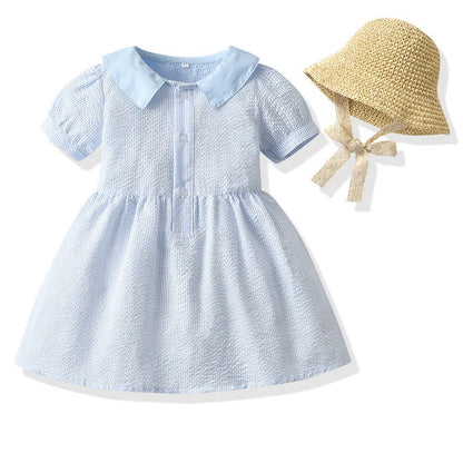 Girl wearing yellow plaid princess cotton dress with matching lace straw hat summer set