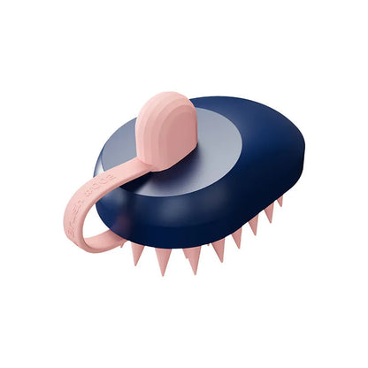 Handheld silicone pet hair remover and massage brush in blue, for use on dogs and cats during bathing.