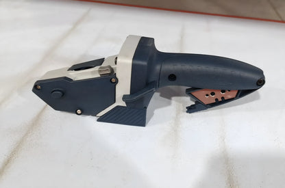 Blue aluminium alloy woodworking cutter with a one-press lock and integrated measuring scale.