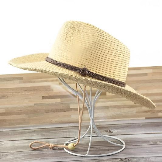 Man's foldable natural straw sun hat with a wide brim shown in mixed beige colour.