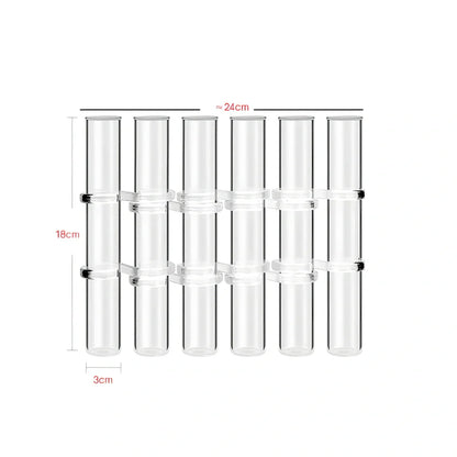 Clear glass hinged test tube vase with plants in curved arrangement