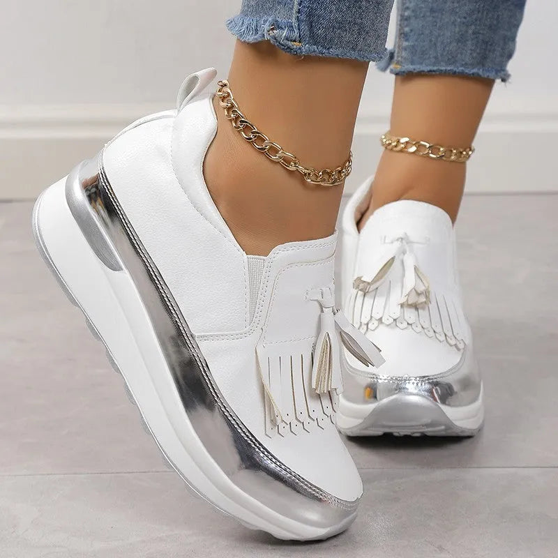 Women's black platform casual shoes with tassel detail and muffin wedge heel