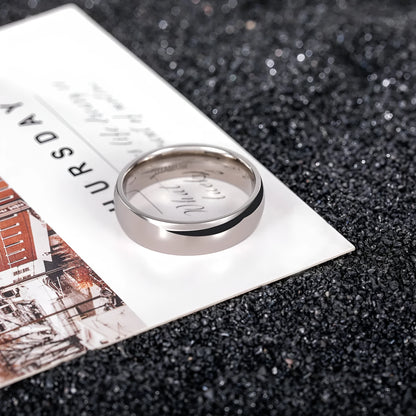 Silver titanium steel unisex ring with grinding texture on finger, showing different band width options.