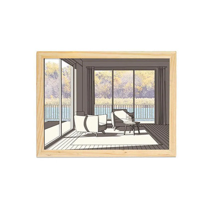 LED illuminated decorative picture light on a table showing a scenic landscape image glowing from within.