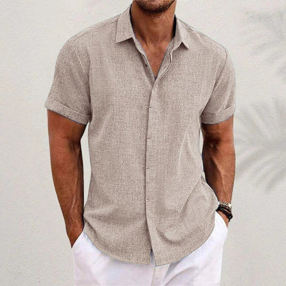 A versatile linen shirt in various colors, featuring a standing collar and short sleeves for a modern, tailored look.