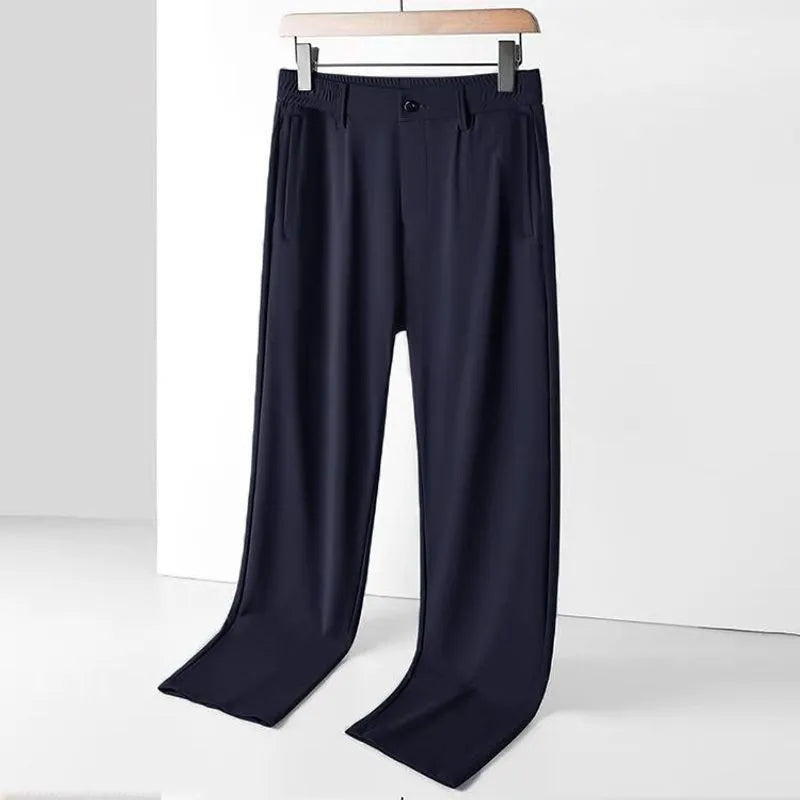 Men's black Ice Silk straight leg leisure trousers with elastic waistband laid flat