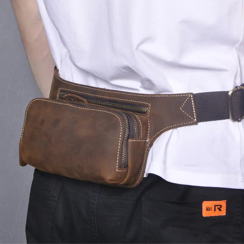 Brown top layer cowhide men's sports waist bag showing 30 cm width, pull closure, and internal phone compartment