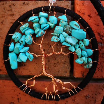 Handmade feather dream catcher wall art with 16cm circular frame and natural materials