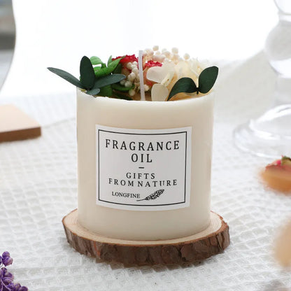 Aromatherapy candle with dried flowers on a wooden chip base, showing blue campanula and lavender scent options.