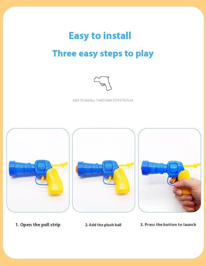 Interactive plastic pet toy gun and soft plush yarn balls on a carpet for fetch games.