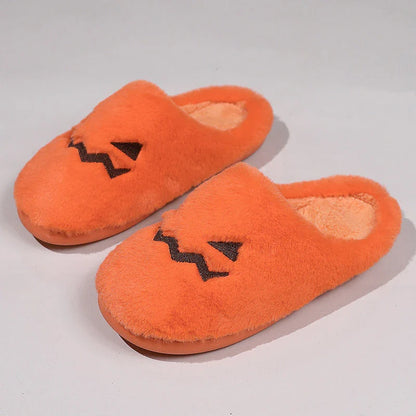 Cozy Halloween pumpkin-themed slippers with plush lining and non-slip soles for comfortable indoor wear