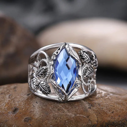 Blue horse eye-shaped women's alloy ring with crystal inlay on a white background.