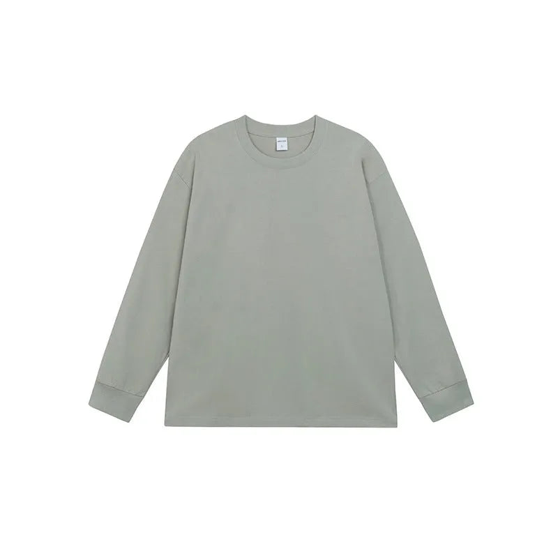 Man wearing a simple solid colour long sleeve cotton t-shirt in a loose, casual fit.