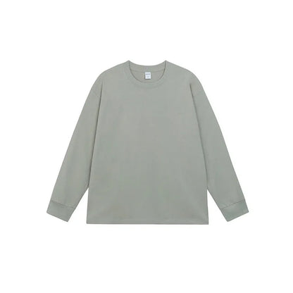 Man wearing a simple solid colour long sleeve cotton t-shirt in a loose, casual fit.