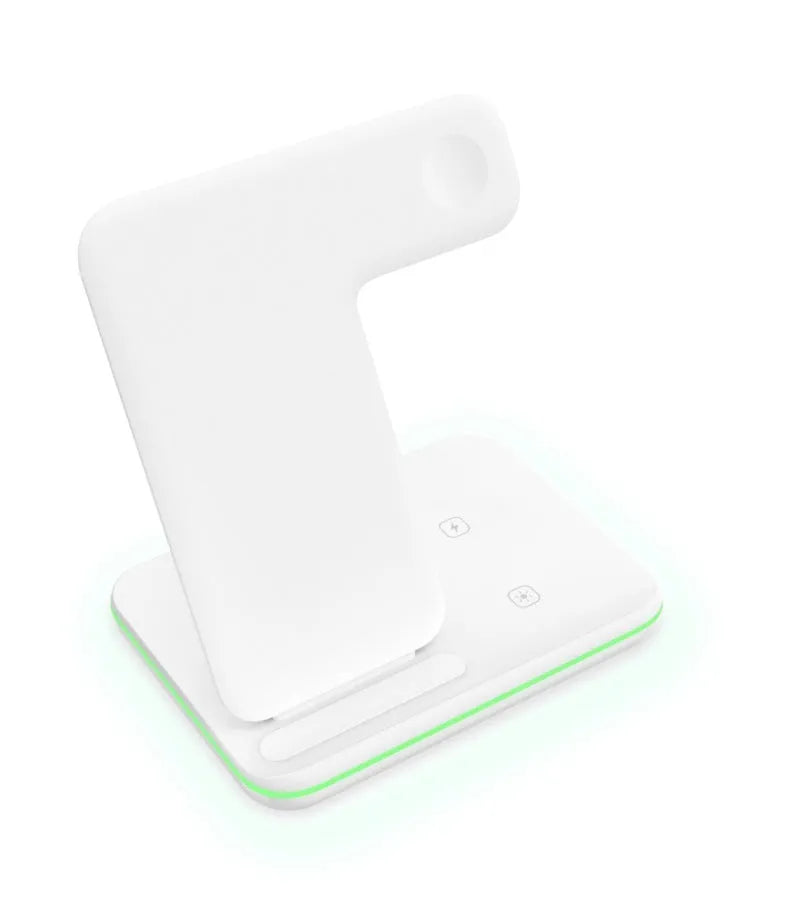 White three-in-one wireless charging stand for mobile phone, watch, and headphones on a desk.