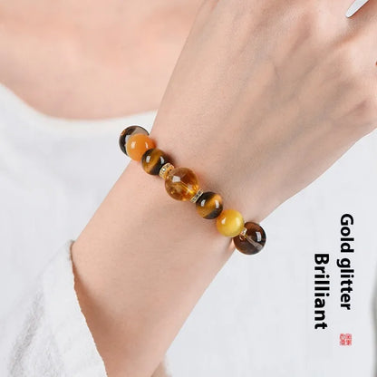 Close-up of a natural yellow 10mm artificial crystal bead bracelet for unisex wear.