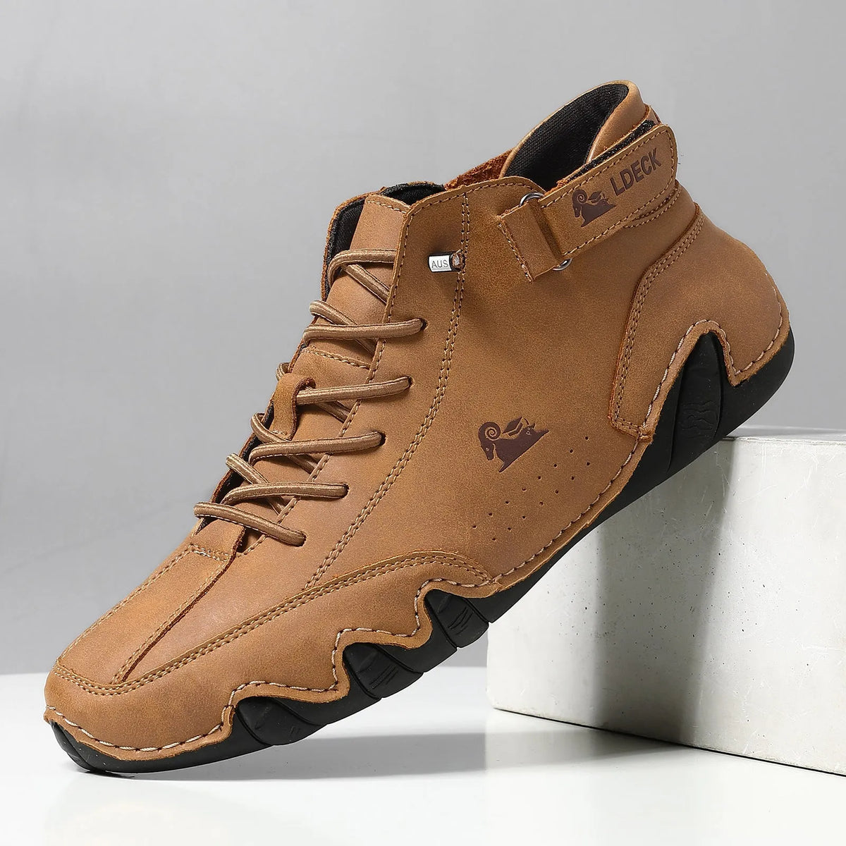 High top men's shoes in khaki with rubber soles and microfiber upper, showing round toe and middle tube height