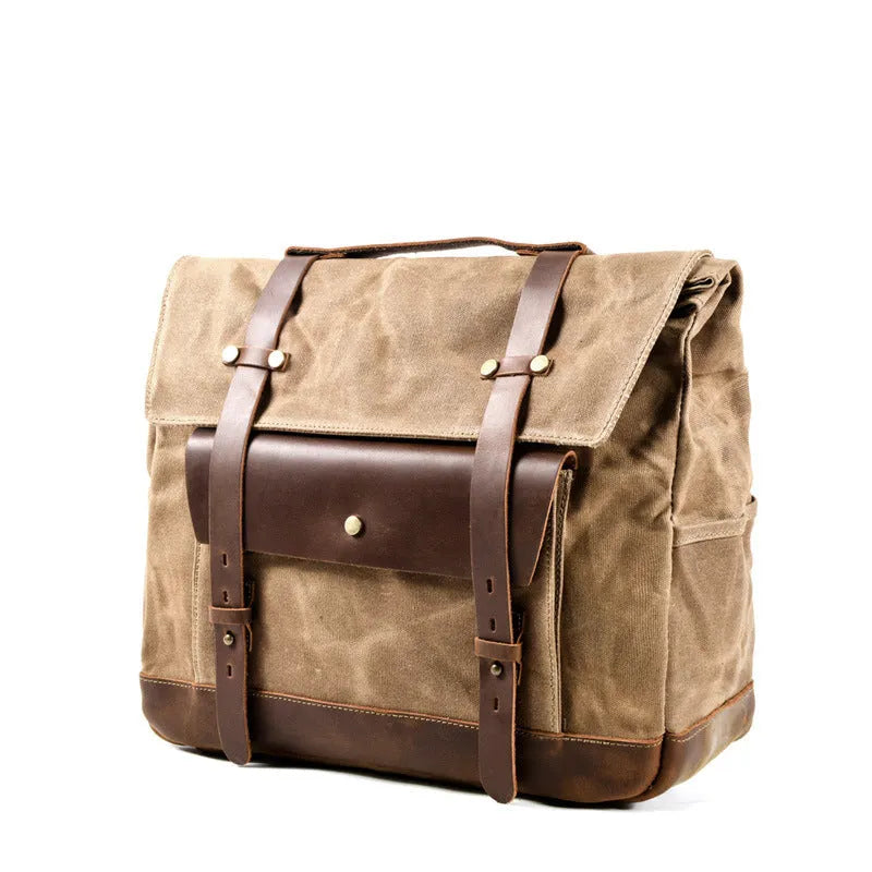 Camel Bag Knight retro cotton messenger bag in army green, showing front flap, rivet details, and size next to a motorcycle helmet.