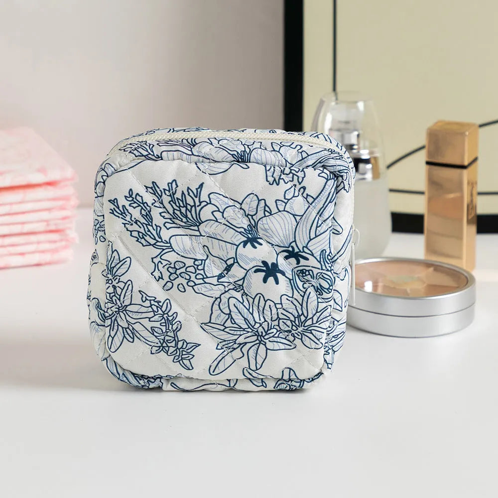 Women's key storage bag with floral patterns including cherry on white background design