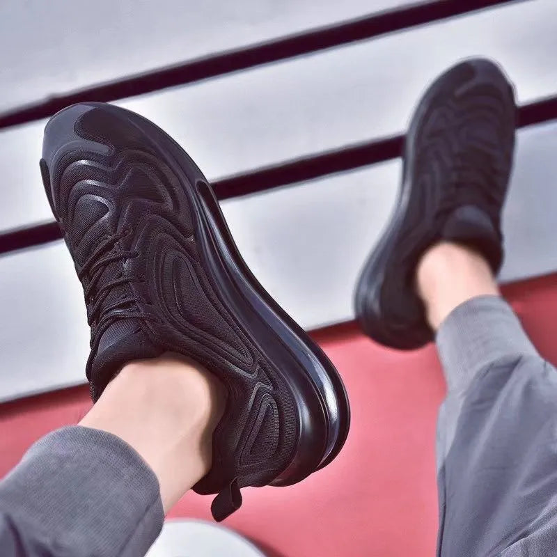 Men's black casual lace-up sneakers with a thick sole on a white background.