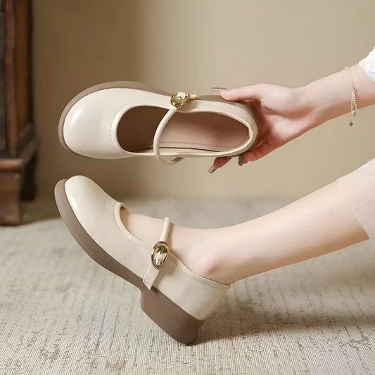 Flat cheongsam leather shoes with wedge heel in black, round toe design and skull pattern visible inside