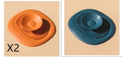 TPR vortex design sink drain cover in twilight orange, quiet blue, mango yellow, and gentian green