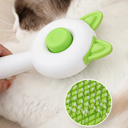 Greenish white pet grooming brush with stainless steel teeth, a push-button, and orange massage beads on the handle.