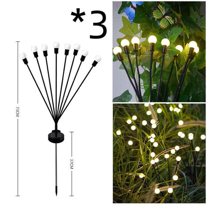 Solar-powered ground plug lawn light with automatic dusk-to-dawn operation and multiple head configurations