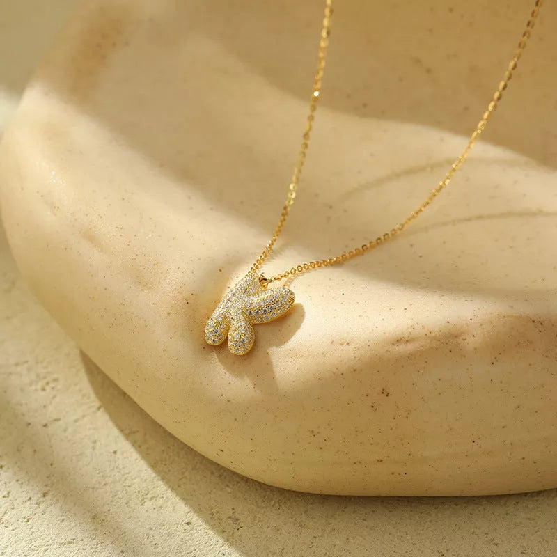 Stainless steel initial pendant necklace with zircon accents, personalized with your choice of letter.