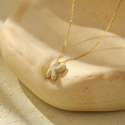 Stainless steel initial pendant necklace with zircon accents, personalized with your choice of letter.